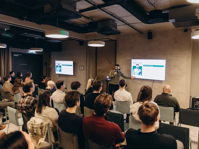 Mo presenting to a full room at TechChill in Latvia.